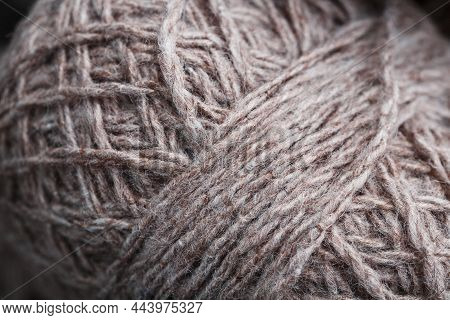 Light Brown Wool Yarn Made Of Threads In Tangles.