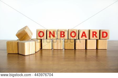Onboard And Onboarding Symbol. The Concept Word Onboard On Wooden Cubes. Beautiful Wooden Table, Whi