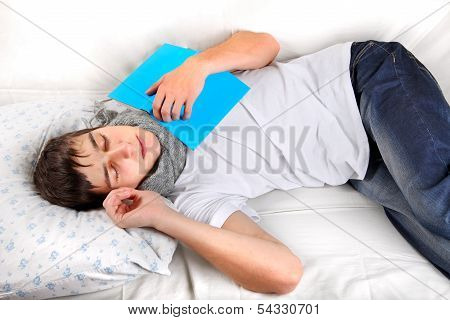 Young Man Sleeps With A Book