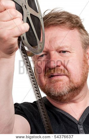 Man Inspecting Film Frames