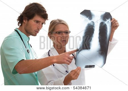 Pulmonologist And Surgeon Watching X-ray