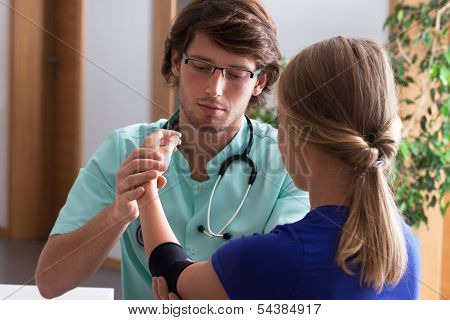 Orthopedist Examining Elbow