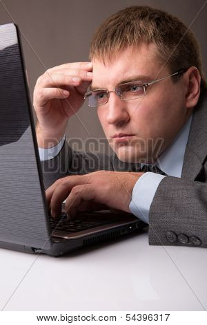 A young office worker working till late