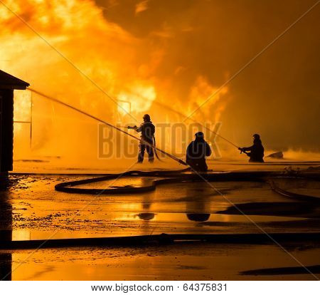 Firemen at work on fire