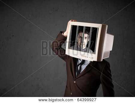 Business man with monitor screen on his head traped into a digital system concept