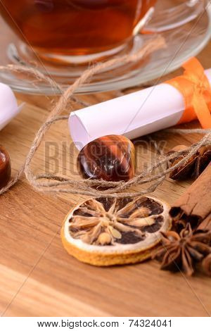 Hot Tea With Lemon And Cinnamon On Wooden Backgroubd