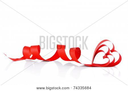 Heart shaped red paper ribbon isolated on white