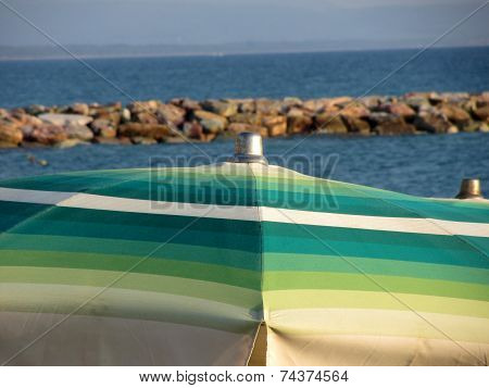 Beach Umbrella On Sea Background