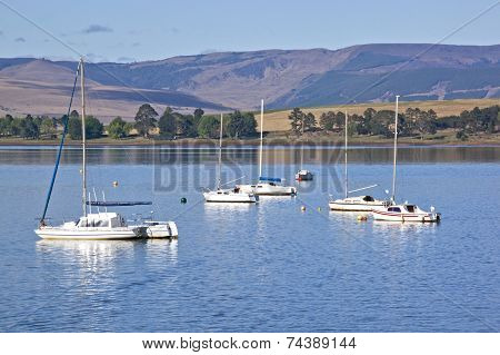 Landscape View Of Mountains Overlooking Idle Yachts
