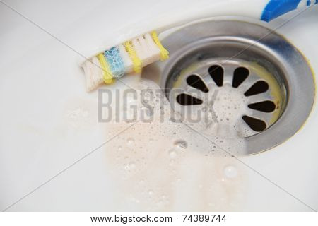 Blood and toothpaste on the toothbrush