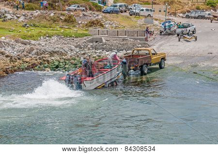 Crayfish Boat Being Pulled Onto Trailer At Kleinmond Harbor
