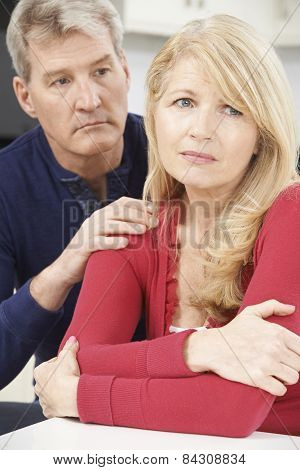 Mature Man Comforting Woman With Depression
