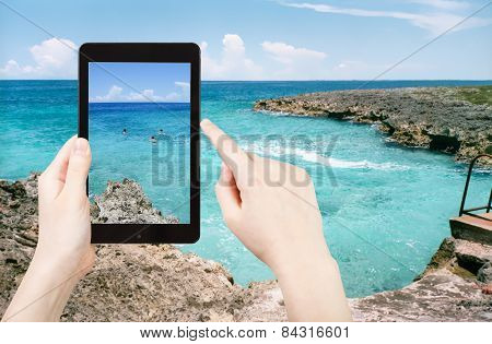 Tourist Taking Photo Of Stone Coastline Of Caribbean Sea