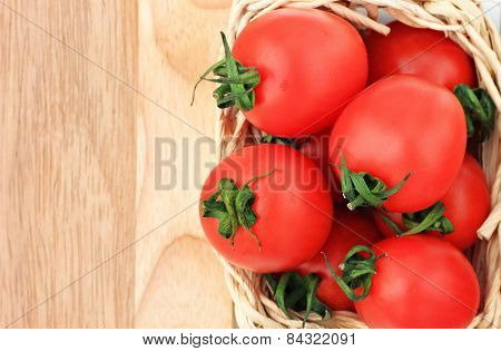 tomatoes in straw basket