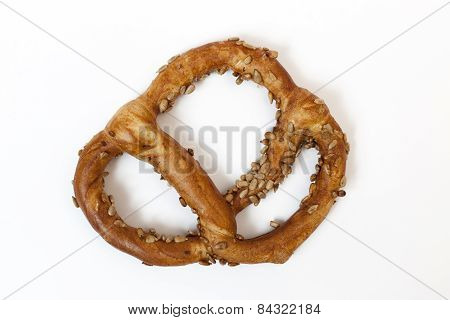 Bavarian Pretzel With Sunflowers Seeds Isolated On White Baskground