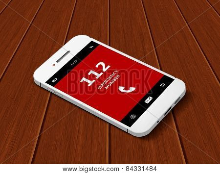 Mobile Phone With Emergency Number 112  Lying On Table