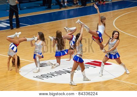 Cheerleaders Dance On Basketball Arena