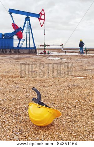 Pumpjack Oil Pump And Protective Helmet