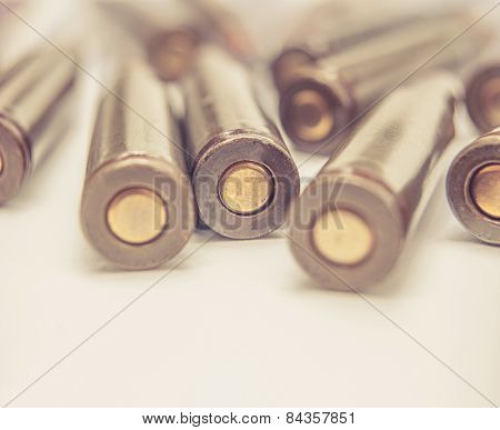 Set of armed cartriges from back toned image and a lot of copyspace