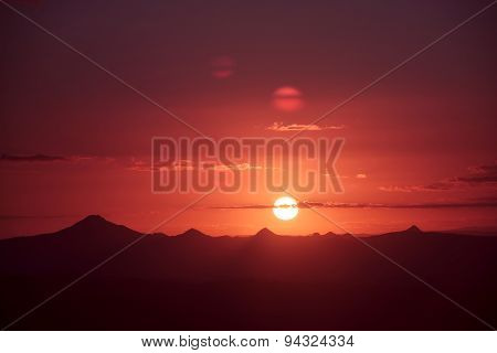 Sunset silhouette over the mountain