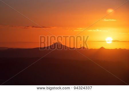 Sunset silhouette over the mountain