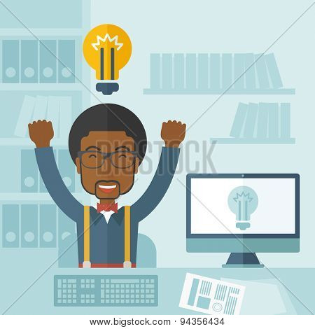 A young black guy is happy raising his two hands getting an idea through computer internet inside his office. Successful concept. A Contemporary style with pastel palette, soft blue tinted background