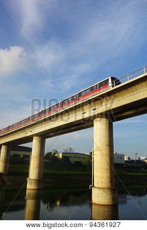 Singapore Mass Rapid Train (mrt) Travels On The Track