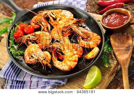 Fried king prawns on iron pan
