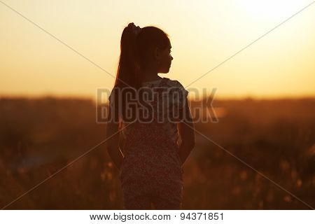 Girl Stands And Looks Into The Distance