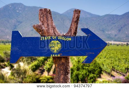 Oregon Flag wooden sign with winery background