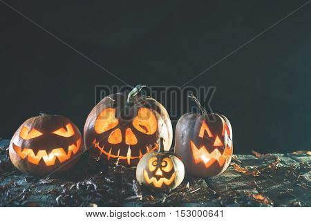 Halloween pumpkin at wood background. October holiday. Pumpkins family