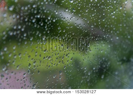 Rain / Water drop of rain on glass with outdoor background