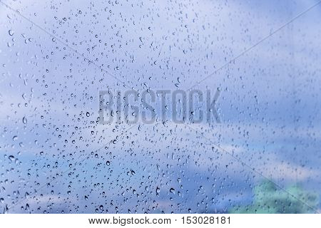 Rain / Water drop of rain on glass with outdoor background