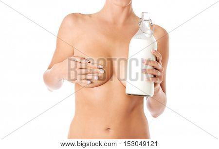 Nude woman is holding a ewer of milk. Spa concept.