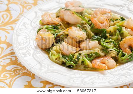 Low carb zucchini spaghetti with shrimp on a tabble