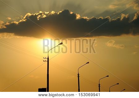 sunset. interesting illumination of a cloud behind
