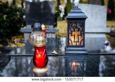 Candles Burning At A Cemetery