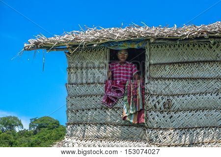 Semporna,Sabah-Sept 10,2016:Sea Gypsy kids on the house on 10th Sept 2016 at Bodgaya Island,Semporna,Sabah.The kids are taught to catch fish,octopus & lobsters off their unique handmade boats