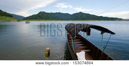 A Fishing Boat Tied At The Shore At Khun Dan Dam, Nakohn Nayok Thailand