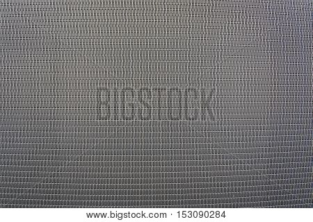 Background sheet of metal covered with abstract lines of holes