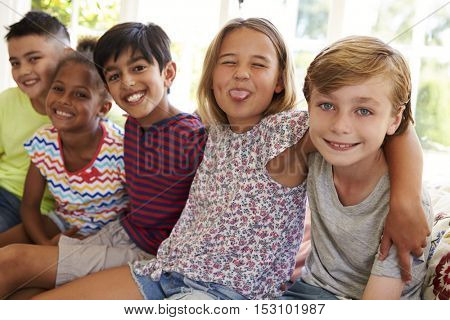 Group Of Multi-Cultural Children On Window Seat Together