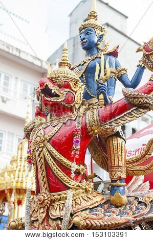 Suratthani Thailand - October 20 2016: Details on ornamented carriers of Buddha images depicting Narai Song Suban (Vishnu mounting the Garuda) to be pulled across the city during the famous Chak Phra Festival an annual Buddhist festival to celebrate the r
