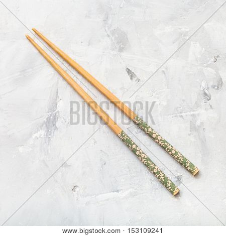 Wooden Chopsticks On Concrete Board
