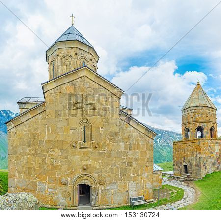 The facade of Gergeti Trinity Church with the Gate Chapel from the right Kazbegi National Park Georgia.