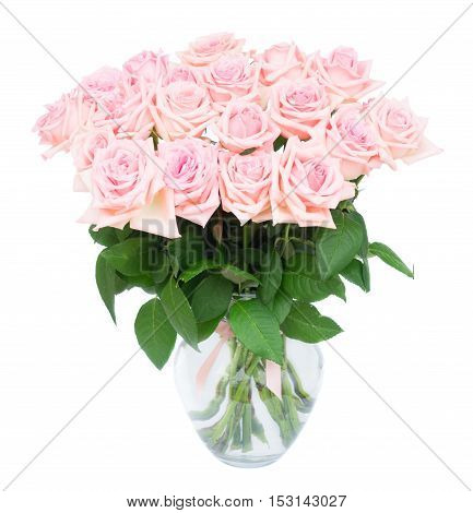 Pink blooming roses bouquet in glass vase isolated on white background