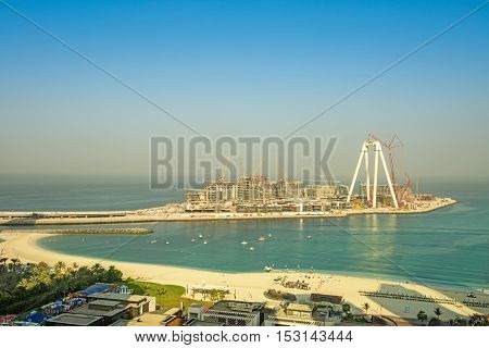 Dubai, UAE - OCTOBER 06, 2016: Bluewaters island construction in Dubai, UAE on October 06, 2016. Located off Jumeirah Beach Residence it will be the world's largest Ferris wheel, The Dubai Eye.