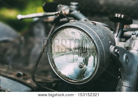 Close View Of Headlight Of The Old Rarity Gray Tricar Or Three-Wheeled Motorbike With A Sidecar.