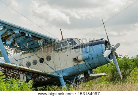 Old russian biplane aircraft An-2 at an abandoned