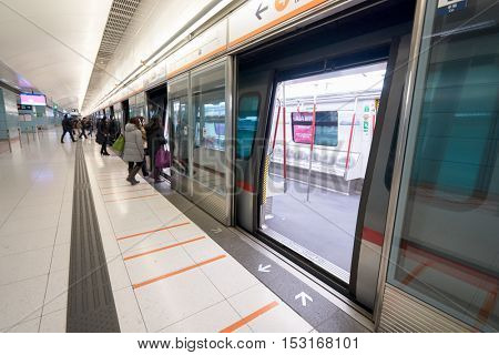 HONG KONG - CIRCA JANUARY, 2016: inside MTR station in Hong Kong. MTR is the rapid transit railway system in Hong Kong. It is one of the most profitable systems in the world