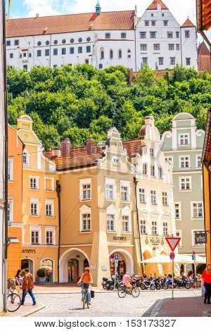 Landshut, Germany - July 04, 2016: Street view with colorful bavarian houses and Trausnitz castle in Landshut old town, Germany